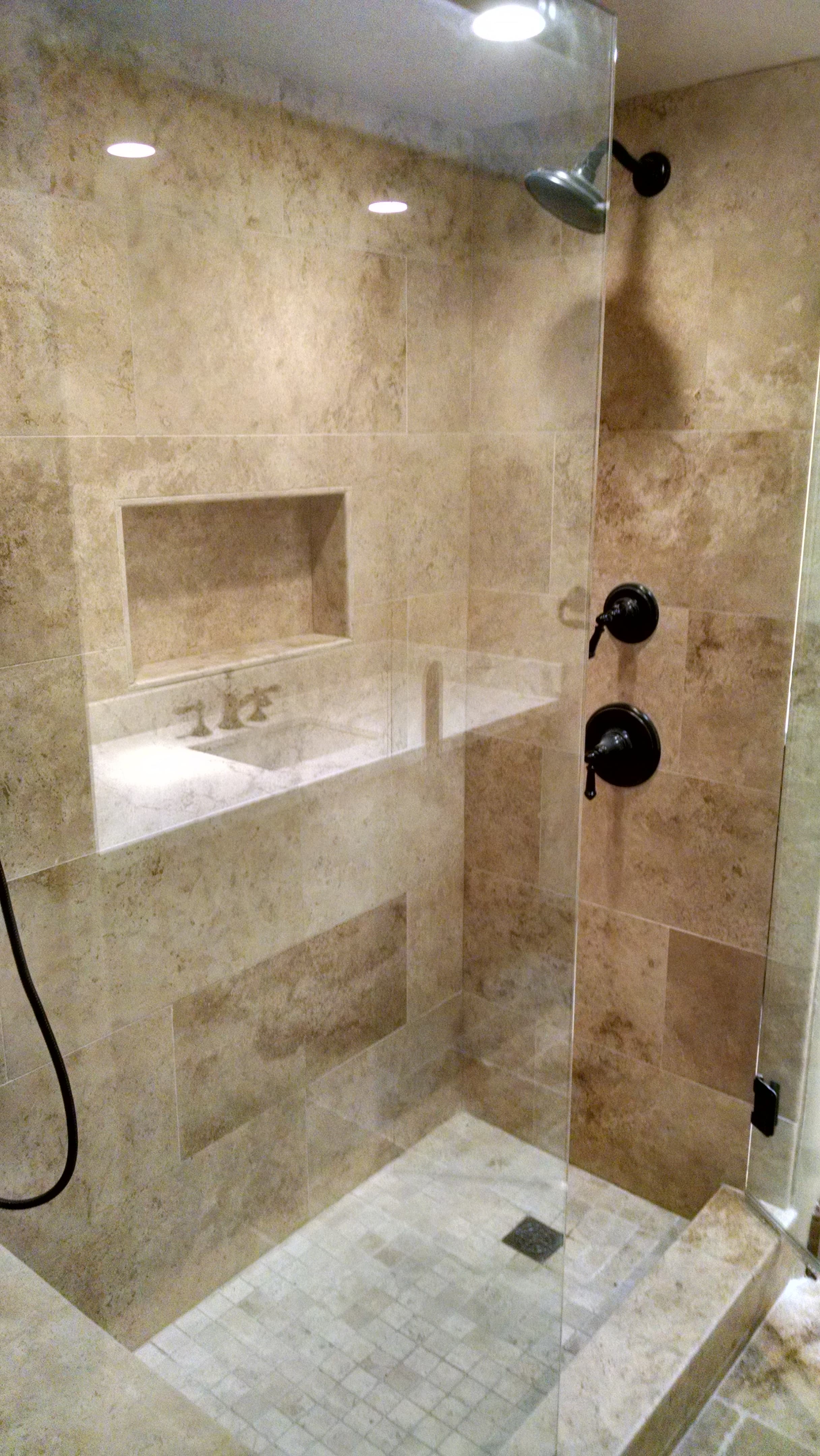 Travertine walk-in shower remodel by McClelland Construction in North County San Diego