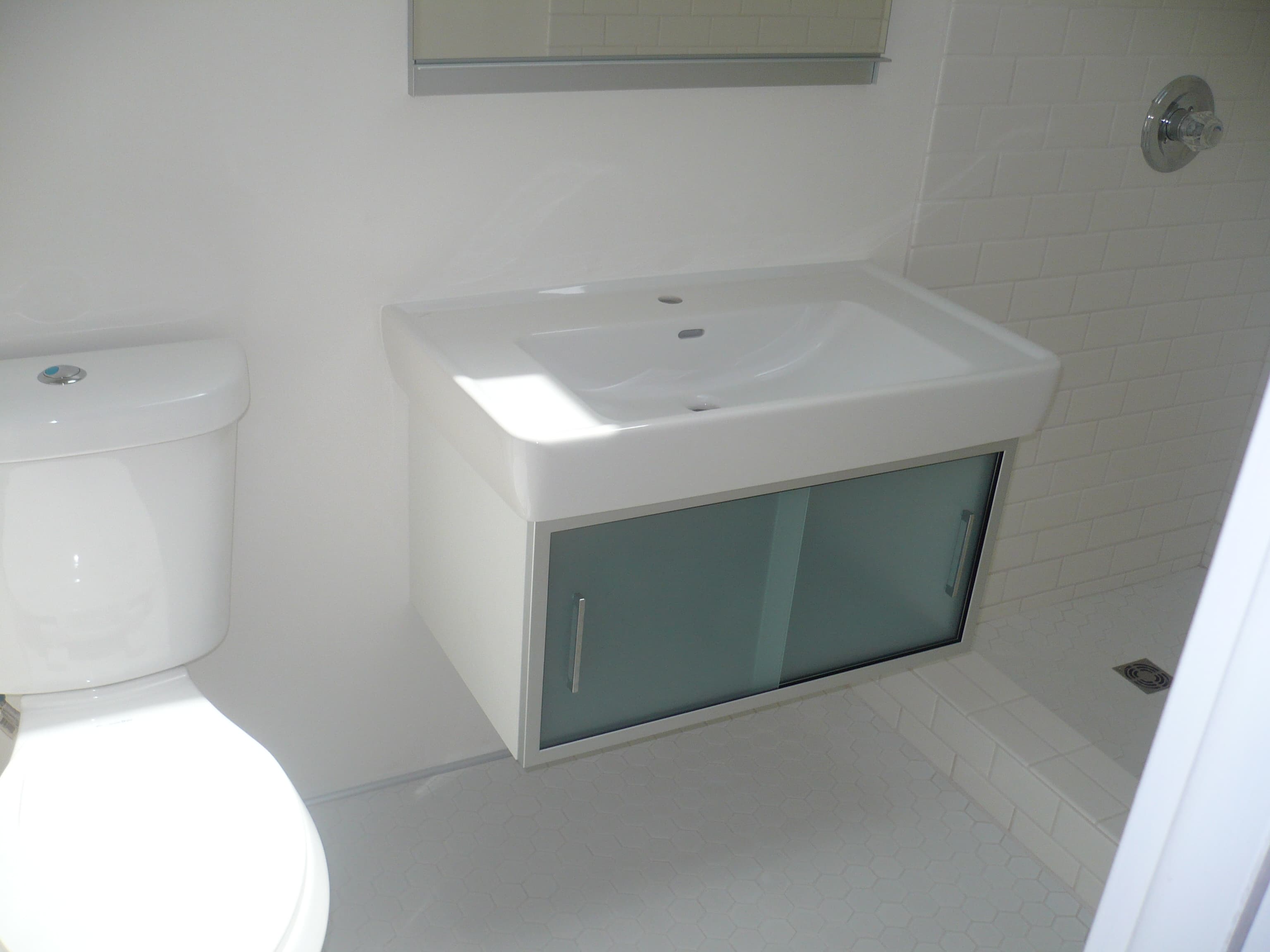Modern Vanity & Hex Tile Floor — after remodel by McClelland Construction
